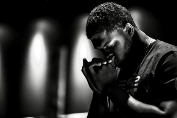 black man praying